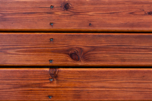 Restored exterior wood deck after professional refinishing and staining