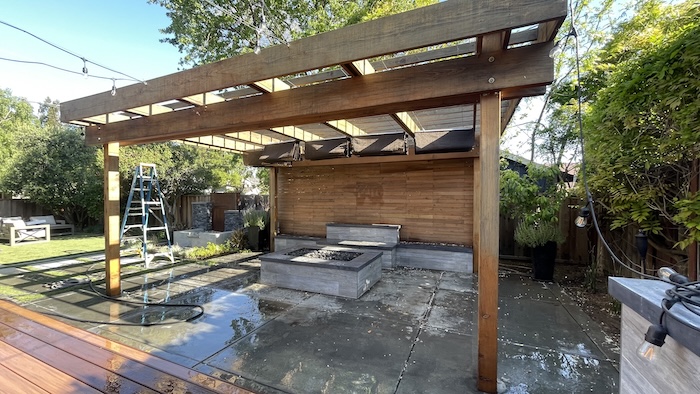 Weathered redwood pergola and wood wall in Los Gatos before refinishing