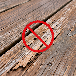 Weathered and cracked deck wood showing damage that proper sealing helps prevent