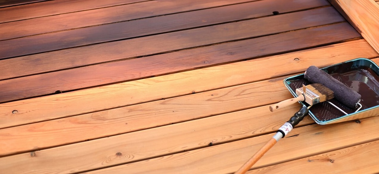 Professional new deck sealing and waterproofing to protect exterior wood from moisture and UV damage