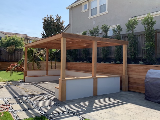 New redwood pergola and retaining wall before sealing and staining in San Jose, CA.