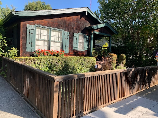 Severely weathered cedar shingle siding and wood fence in Palo Alto before restoration