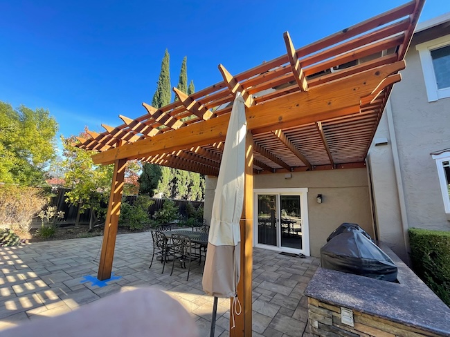 Wood pergola after restoration in Redwood City, California with restored natural wood color and semi-transparent exterior stain