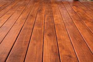 Restored exterior wood deck after professional refinishing and staining