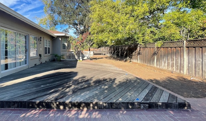Weathered wood deck and faded fence in Saratoga before refinishing and staining