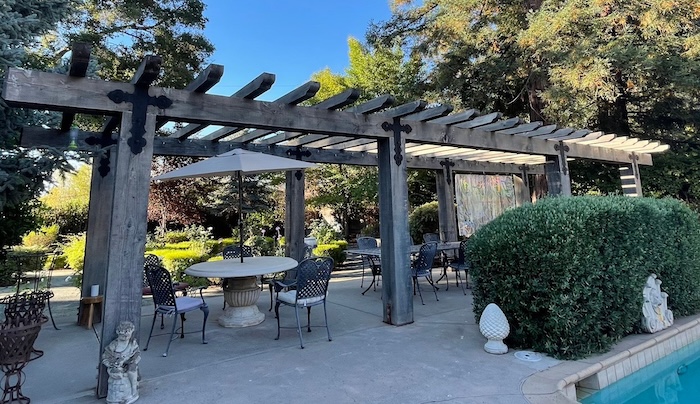 Gray and weathered wood pergola in Saratoga before pressure washing and staining