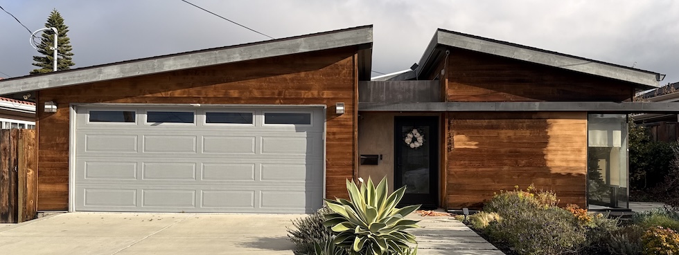 Weathered cedar wood siding in Fremont before professional restoration and refinishing