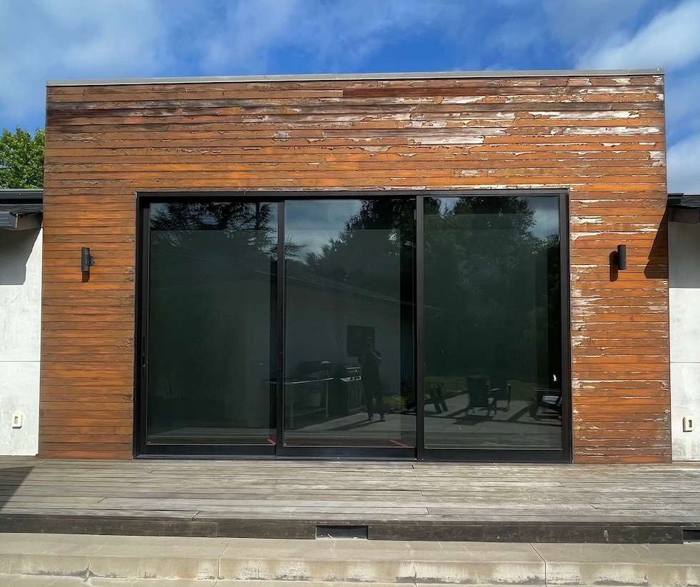 Weathered cedar wood siding in Saratoga before professional restoration