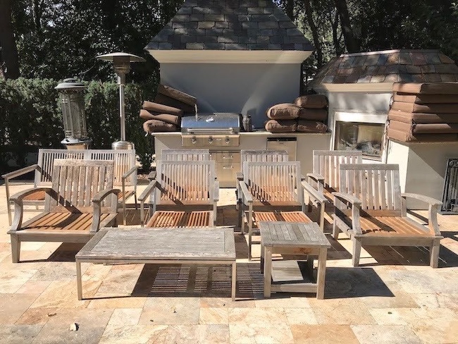 Faded gray teak patio chairs and tables before restoration in Los Altos