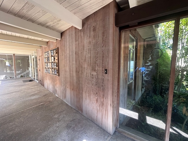 Weathered redwood siding in Oakland before professional restoration and refinishing