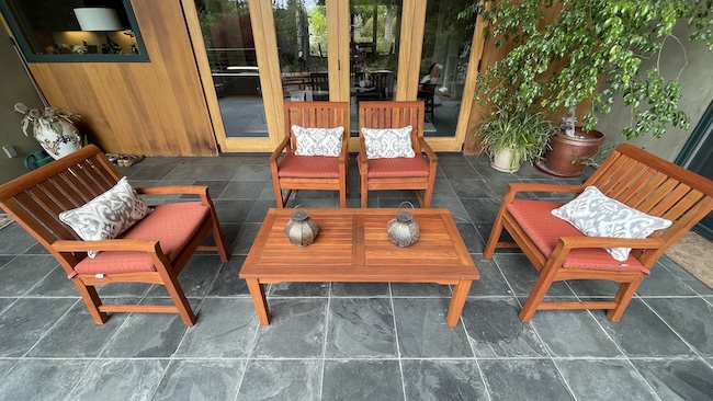 Restored teak patio seating set after professional refinishing in San Mateo